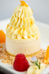 Wall Mural - Soft and creamy orange and ricotta cheesecake accompanied with fresh fruit.