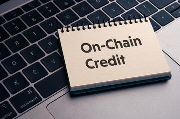 Poster - There is notebook with the word On-Chain Credit. It is as an eye-catching image.