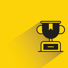 Wall Mural - trophy with shadow on yellow background