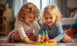 Little blonde girls have fun, laugh and indulge playing board game.
