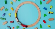 Toy Wooden Train With Cars Rides On Round Railroad On Blue Background