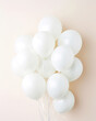 Simple beige background with bunch white balloons. Greeting card for wedding, birthday, party, celebration