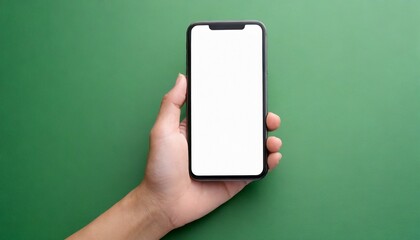 Hand using smartphone with blank screen, isolated on green background 