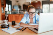 © Geber86 - Happy Young Woman Working on Laptop at Home