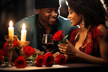 Couple In Love With Wine, Candles, Hearts And Lights, Enjoying Time Together Smiling During Valentine