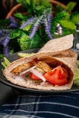 Canvas Print - Wholegrain tortilla wraps with vegetables and chicken on a plate.