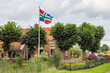 Small house with colorfull flag from Groningen province in Siddeburen municipality Midden-Groningen in The Netherlands