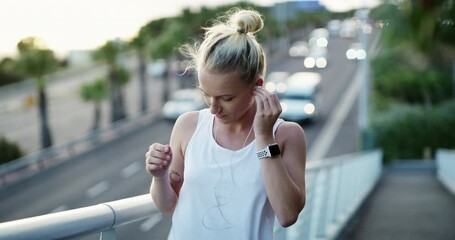 Wall Mural - Earphones, fitness and young woman in city preparing for cardio race, competition or marathon training. Sports, exercise and female athlete running and listening to music, radio or podcast in town.