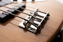 Close Up To The Bridge And Single Pickup On Body Part Of 4 String Jazz Bass Guitar