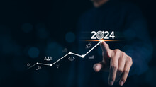 The 2024 New Year Business Goals Concept. Businessman Touching Increase Arrow Graph Company Future Growth 2024. Business Plan Target Strategy, Planning And Challenge Business Strategy In New Year,