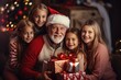 Happy grandfather and children with christmas tree in december open gifts