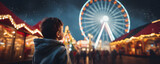 Fototapeta  - happy child watching the lights of a Christmas market with ferris wheel in the bokeh background