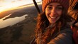 © sirisakboakaew - taking selfie during sunrise hot air balloon