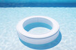 A circular ring shape tyre or float for bathing child in the blue swimming pool 