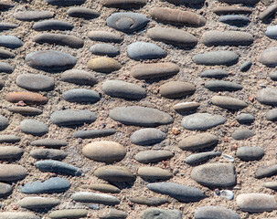 Sticker - Pebble road as an abstract background. Texture