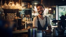 Smiling Male Bartender Prepares Drinks Using A Coffee Maker In A Coffee Shop.