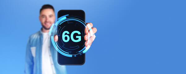 Poster - Man holding smartphone with 6G glowing icon connection on screen