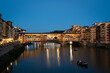 Ponte Vecchio in Florence, Italy at sundown as people prepare for Fochi di San Giovanni