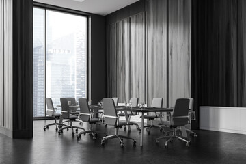 Wall Mural - Black wooden conference room interior with table and seats, panoramic window