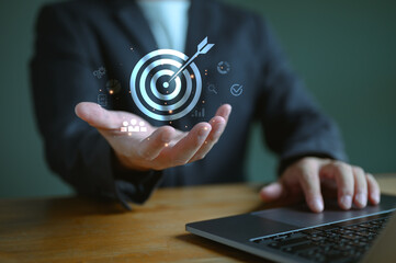 Poster - Digital marketing. Businessman holding virtual graphic darts aiming at the target center with icon set. Business goal and technology concept, target, digital, business, vision, communication, online.