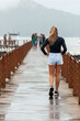 woman walking on the pier