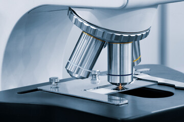 Poster - Close up  microscope in the laboratory. A laboratory technician makes microscopic bacteriological examination.