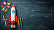 Rocket and school supplies on blackboard background. Back to school concept