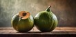  a couple of green fruit sitting on top of a wooden table with steam coming out of the top of them.