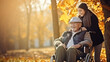 © PaulShlykov - senior man in wheelchair with happy caregiver daughter fall time