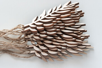 Sticker - stack of decorative wooden leaf cutouts on paper