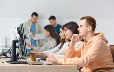 Poster - Team of young programmers working in office