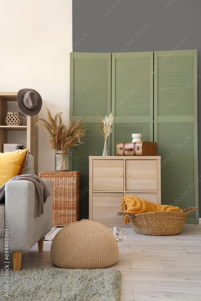 Interior of living room with drawers and folding screen