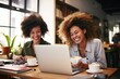© Fotograf - Two women sitting at a table working on a laptop. Suitable for business, teamwork, and office concepts