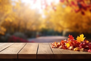 Sticker - A wooden table covered in vibrant autumn leaves. Perfect for fall-themed designs and seasonal projects