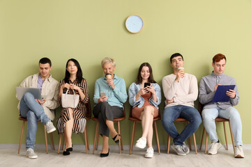 Sticker - Applicants waiting for job interview near green wall in room