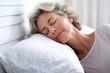 © Carmen Martín J. - Peaceful Repose: Capturing the Calm Sleep of an Older Woman on a White Pillow