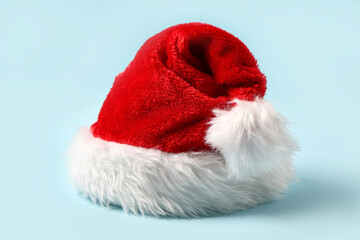 Wall Mural - Santa Claus hat on blue background