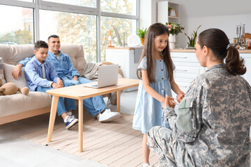 Canvas Print - Little girl with her military mother at home