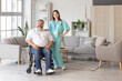 © Pixel-Shot - Mature man in wheelchair with nurse at home