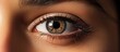 Close-up of a woman's healthy brown eyes, addressing eye issues.