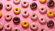 Donuts pattern. Different types of donuts on pink background. Chocolate, glaze and caramel donuts