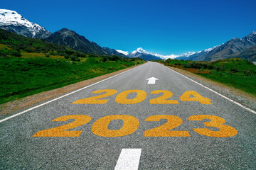 Wall Mural - 2024 New Year road trip travel and future vision concept . Nature landscape with highway road leading forward to happy new year celebration in the beginning of 2024 for bliss and successful start .