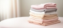 Pile of baby jersey textile in pastel colors