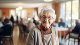 Fototapeta  - elderly woman smiling while inside a nursing home,  copy space, 16:9