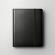 Fotografia de estilo mockup de agenda de cuero de color negro sobre fondo de tono neutro