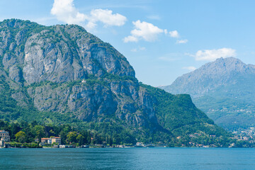 Poster - Steep rock face of mountain on edge of lake