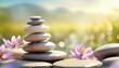Stack of zen stones and flowers. Pile of pebbles; balance and harmony concept. Peaceful nature background for spa; natural wellness and yoga center. Symbol of mental health with copy space