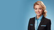 Blonde woman in flight attendant uniform isolated on pastel background