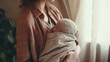 © PixelQraze - Cozy Cradle: Mother's Gentle Hold of Her Newborn