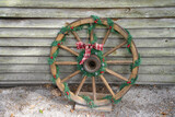 Fototapeta  - old wagon wheel rustic christmas decor